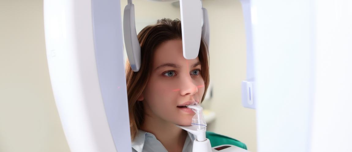 Woman getting scan of her teeth and jaw