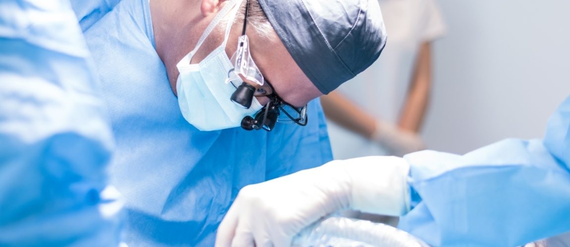 Oral surgeon treating patient