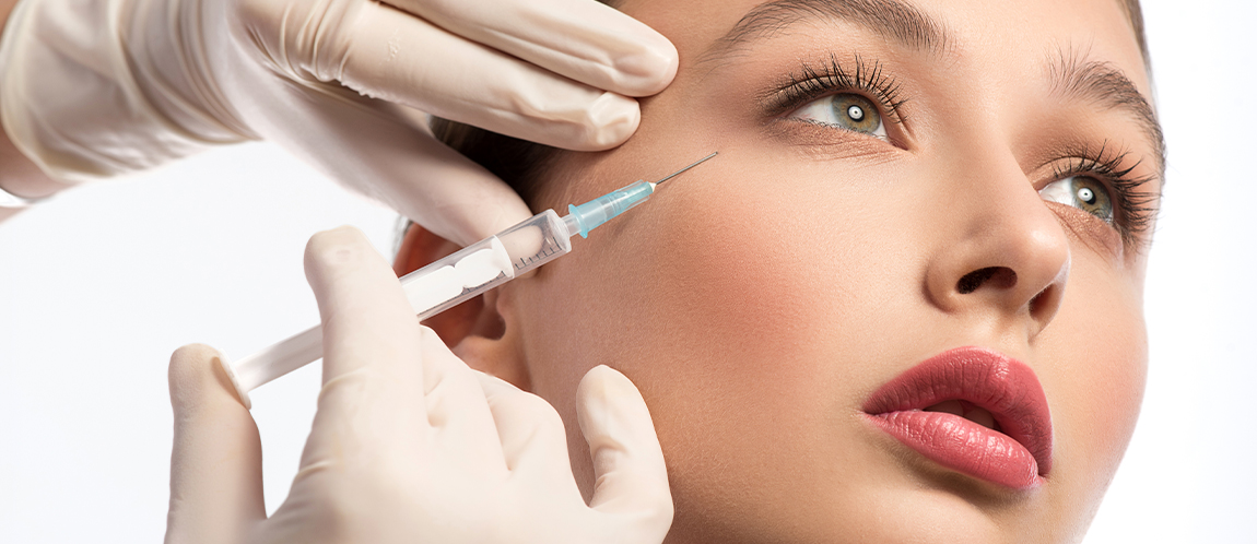 Woman receiving injection under her eye