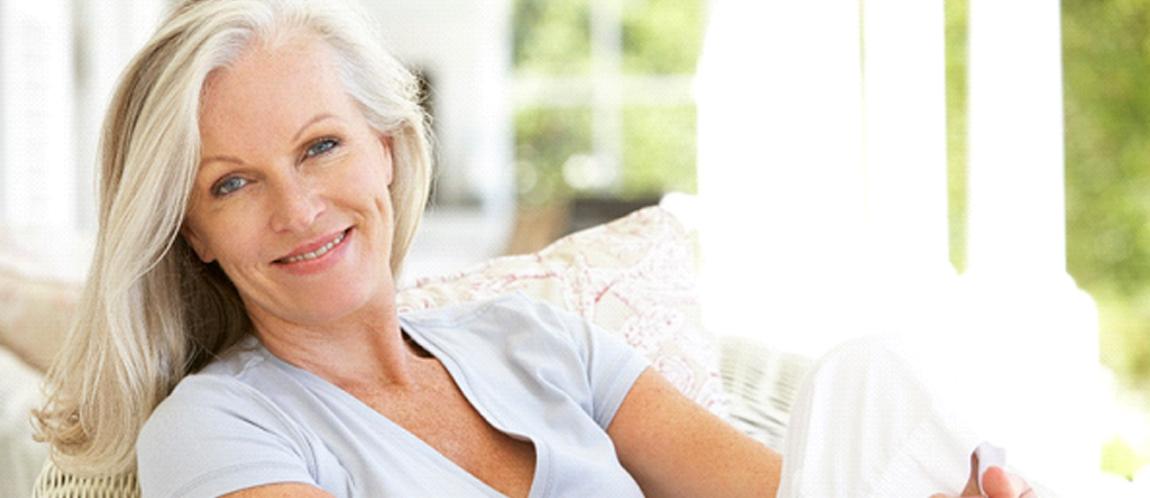 Older woman smiling on couch