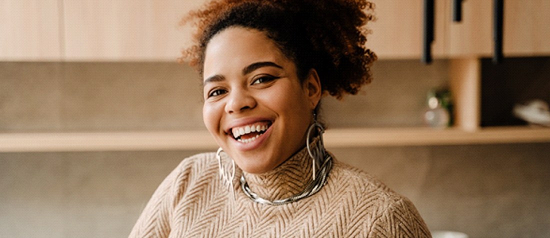 Woman smiling in kitchen