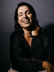 Woman in black blouse smiling