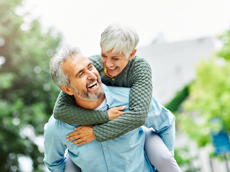 older couple smiling with dental implants