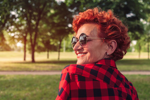 50-year-old woman outside with sunglasses